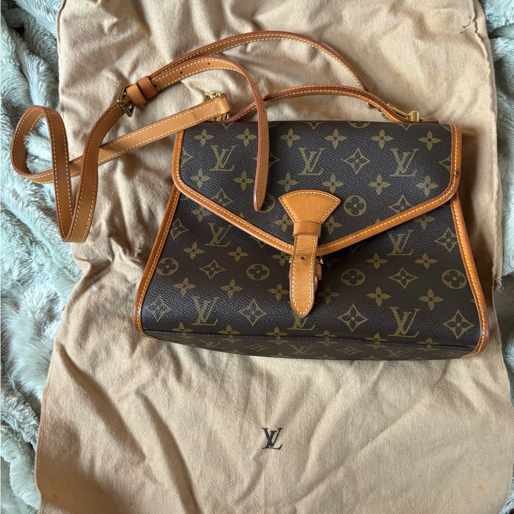 Louie Vuitton Cross Body bag with belt buckle